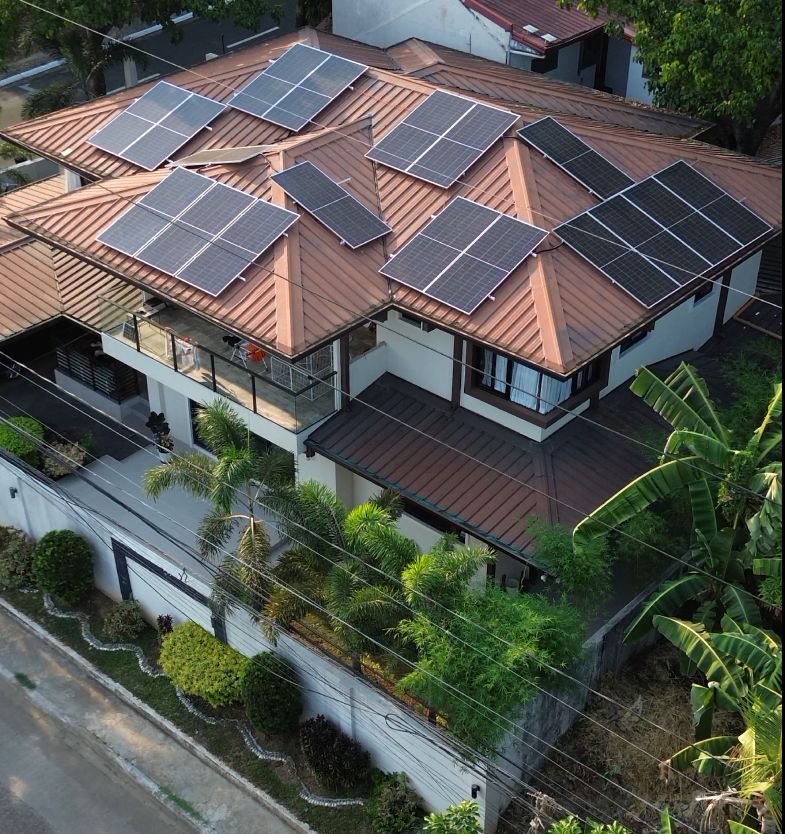 Home solar panel installation on a residential roof in the Philippines